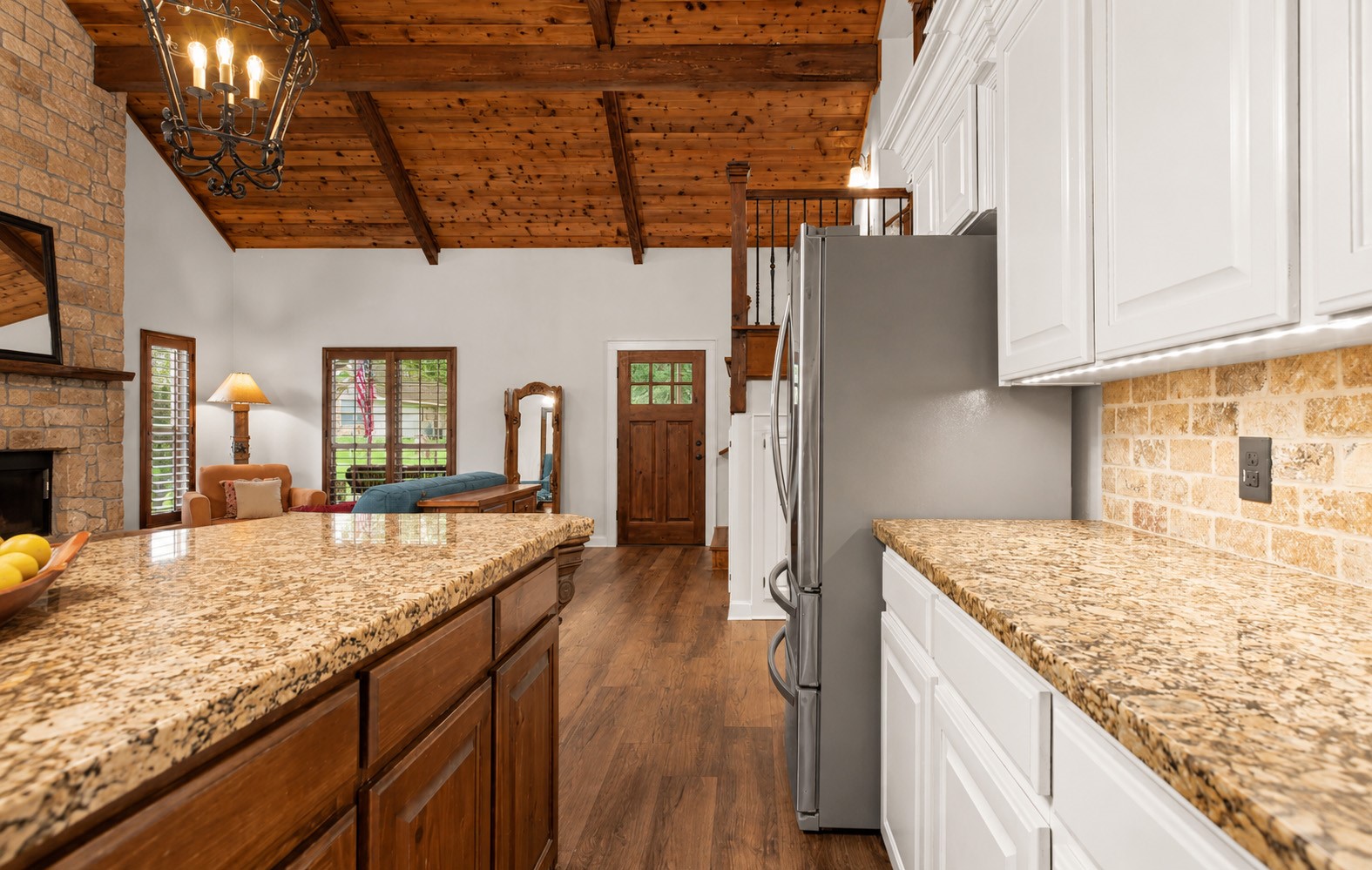 312 Springwood Drive Conroe, TX 77385 - Photo 19 of 50 Enjoy preparing meals while visiting with family and friends in the open concept kitchen area.