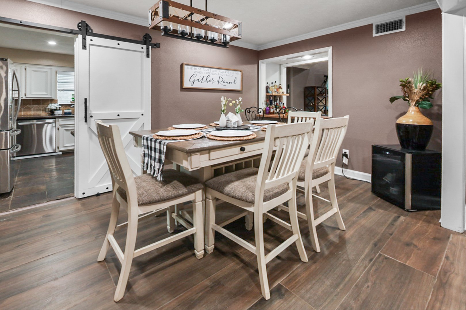4505 Country Club View Baytown, TX 77521 - Photo 11 of 42 a view of a dining room with furniture wooden floor and chandelier