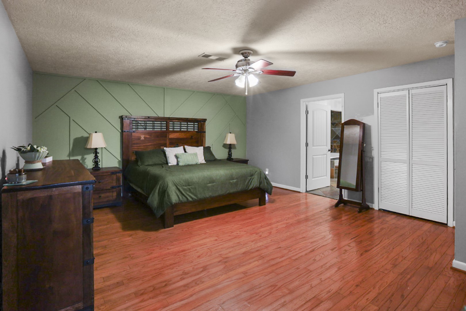 4505 Country Club View Baytown, TX 77521 - Photo 22 of 42 a bedroom with a bed and wooden floor