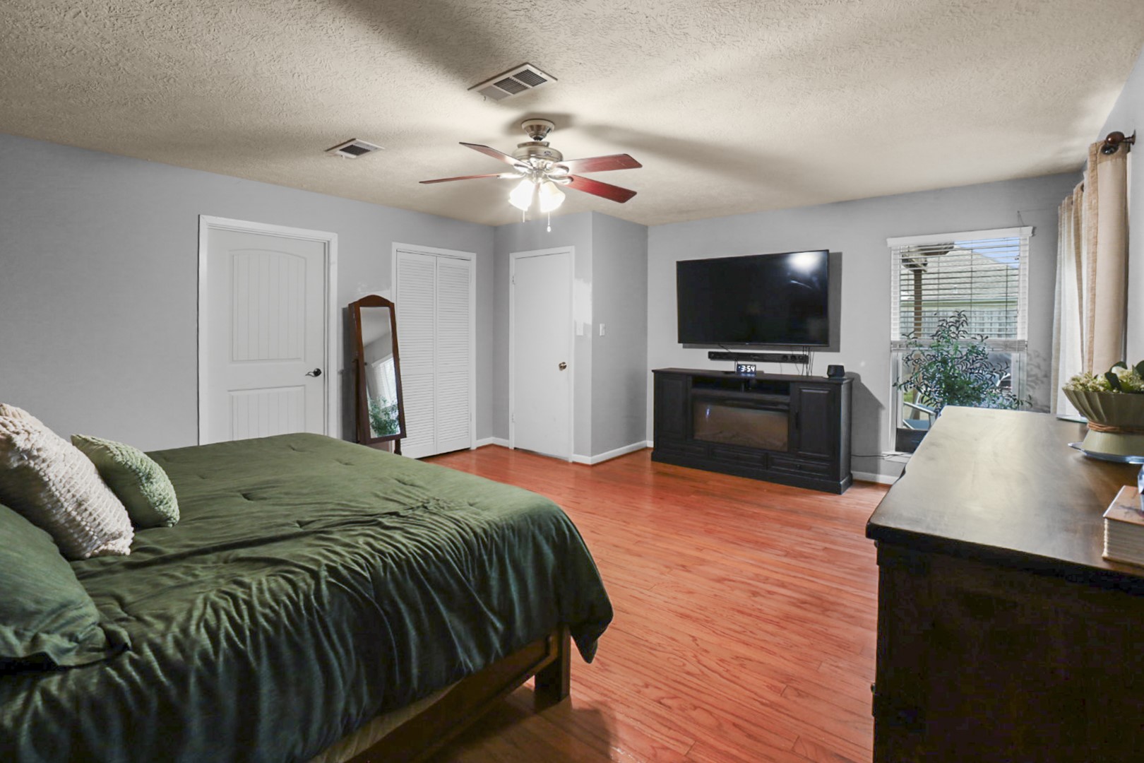 4505 Country Club View Baytown, TX 77521 - Photo 24 of 42 a bedroom with a bed and a flat screen television