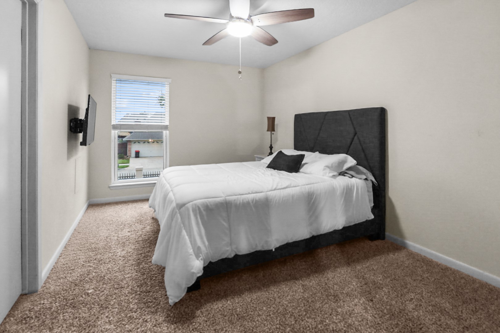 4505 Country Club View Baytown, TX 77521 - Photo 33 of 42 a bedroom with a bed and a chandelier