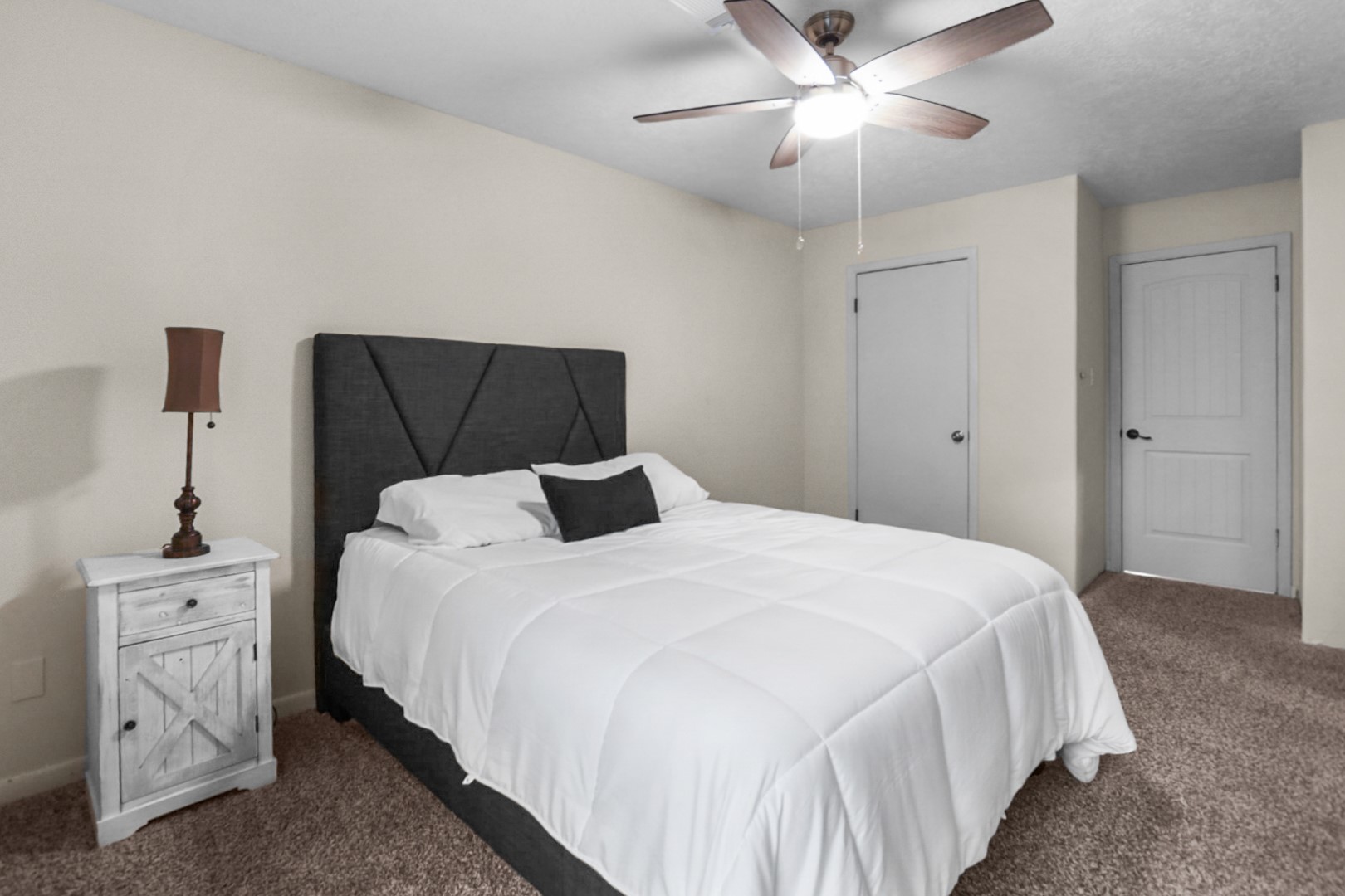 4505 Country Club View Baytown, TX 77521 - Photo 35 of 42 a bedroom with a bed and a chandelier