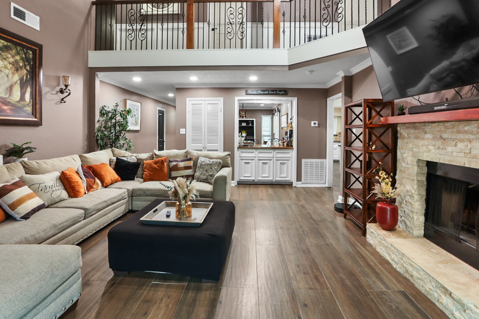 4505 Country Club View Baytown, TX 77521 - Photo 7 of 42 a living room with furniture a fireplace and a flat screen tv