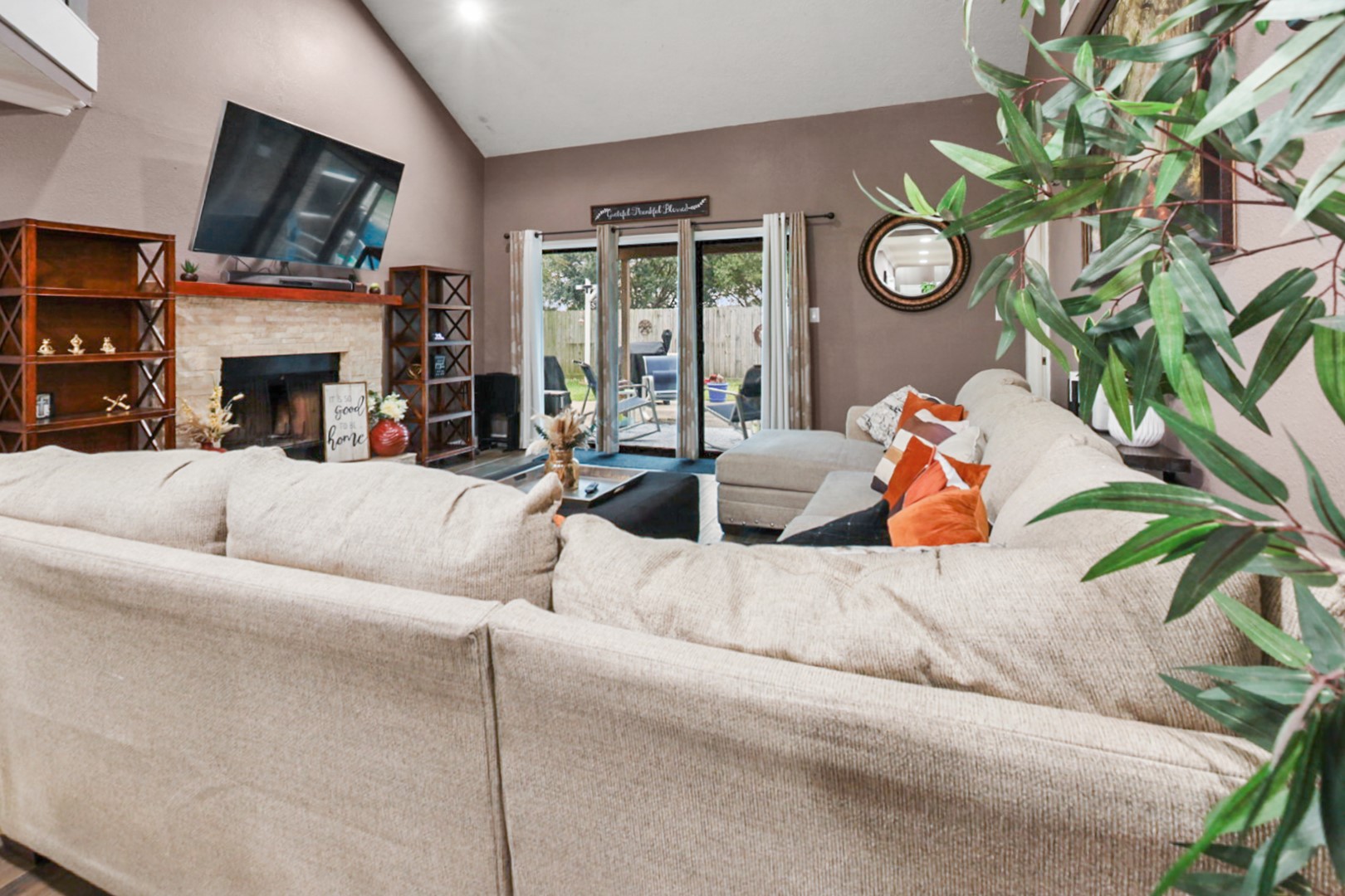 4505 Country Club View Baytown, TX 77521 - Photo 10 of 42 a living room with furniture a fireplace and a window