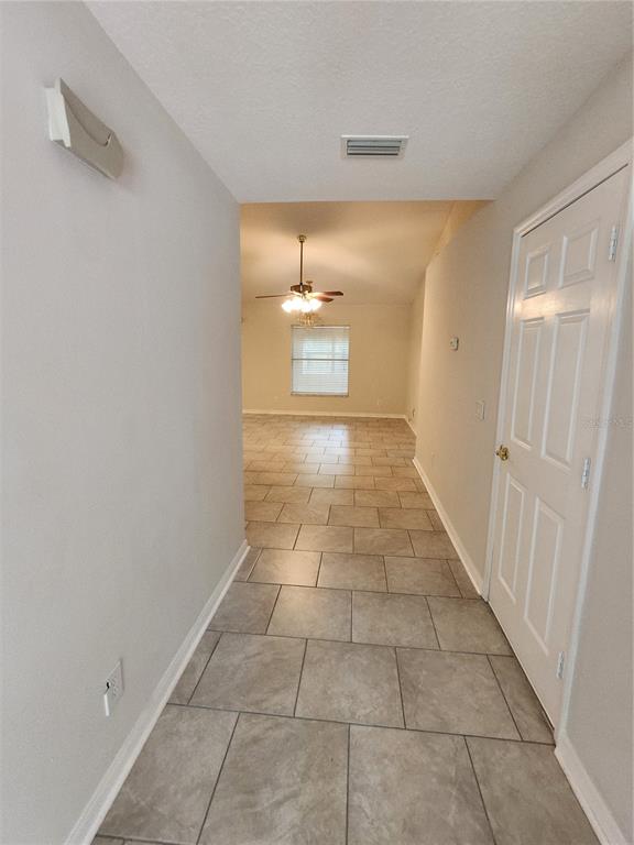 6521 East Grayson Street Inverness, FL 34452 - Photo 2 of 16 a view of an empty room and window