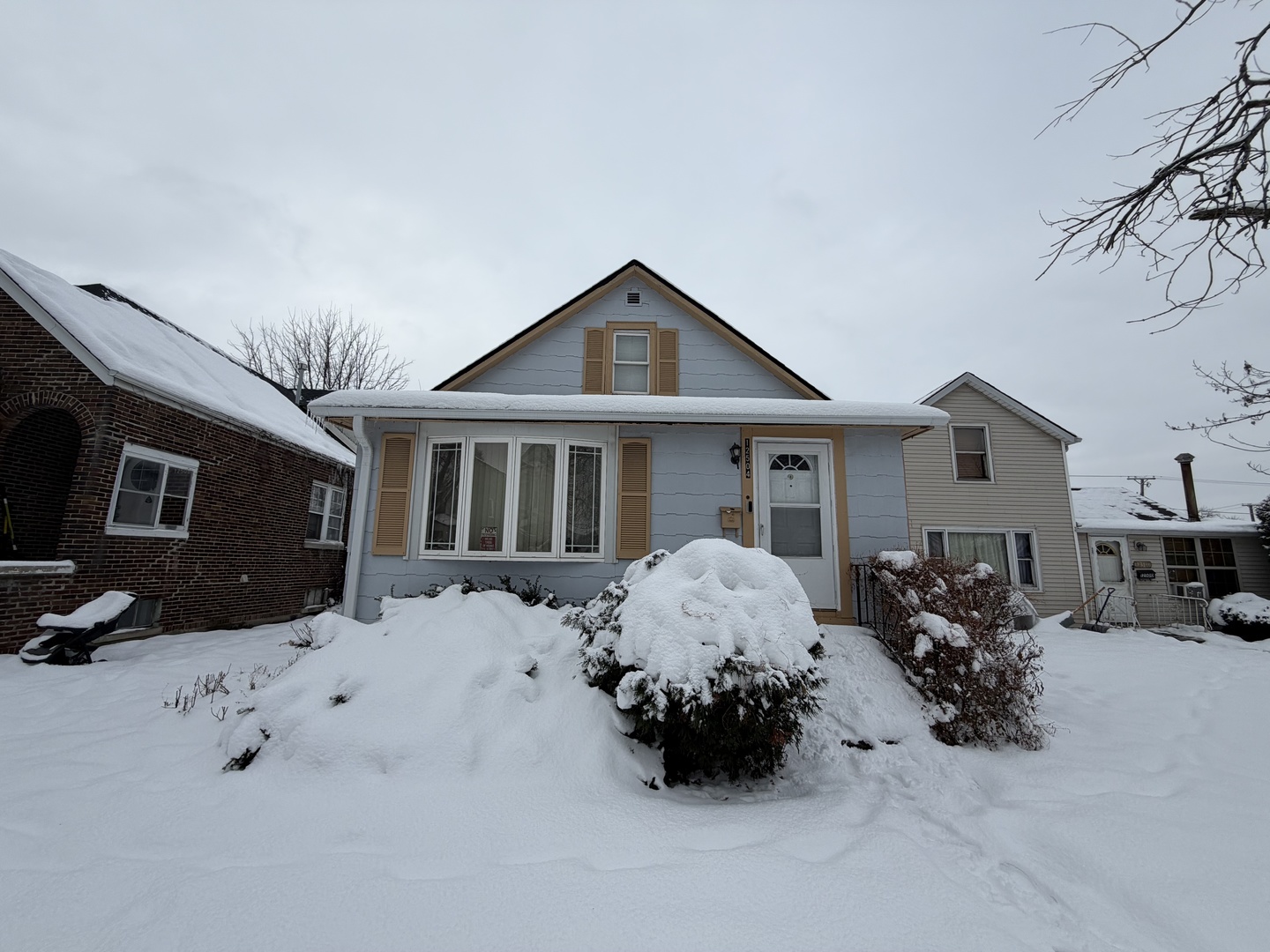 a front view of a house with many windows