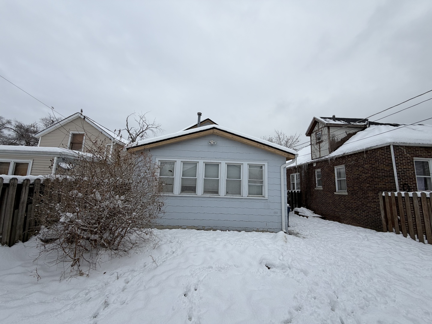 12504 Maple Avenue Blue Island, IL 60406 - Photo 2 of 10 a front view of a house with a yard and garage