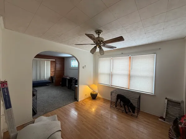 a bedroom with furniture and a window