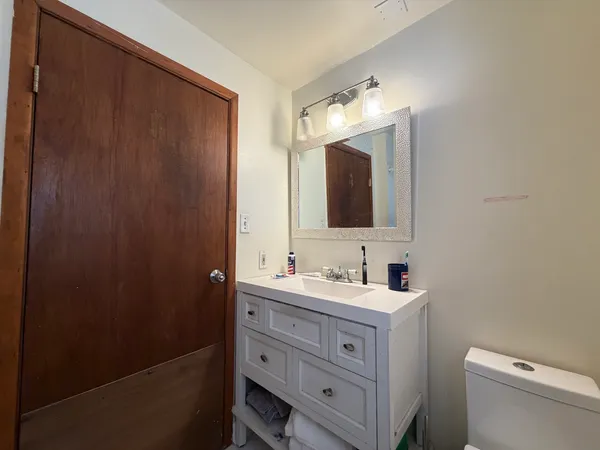 a bathroom with a double vanity sink and mirror