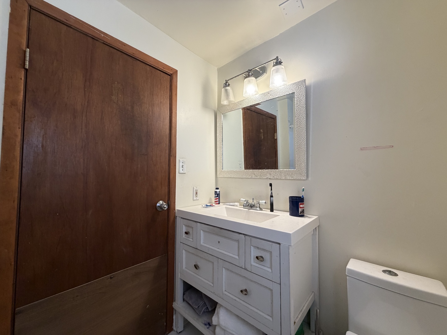 12504 Maple Avenue Blue Island, IL 60406 - Photo 9 of 10 a bathroom with a double vanity sink and mirror