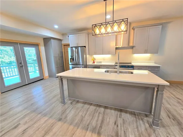 a room with wooden floor and window