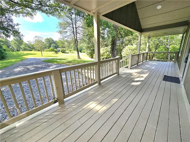 a view of balcony with wooden floor