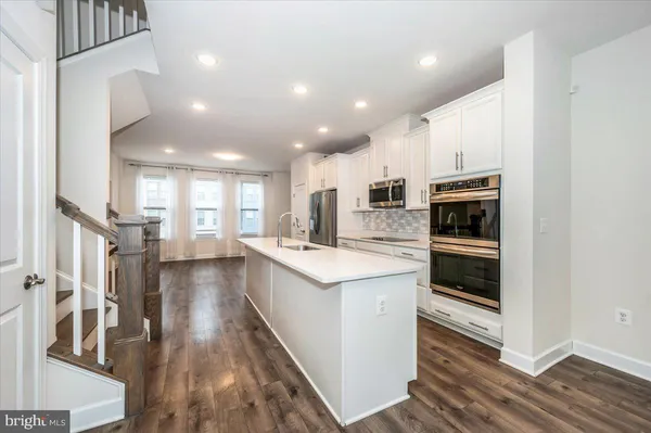 a kitchen with sink and stove