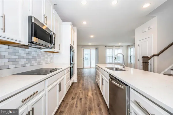 a bathroom with a sink a mirror and toilet