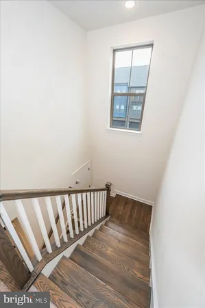 a view of empty room with ceiling fan
