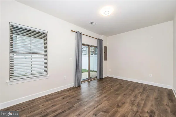 a front view of a building with a garden