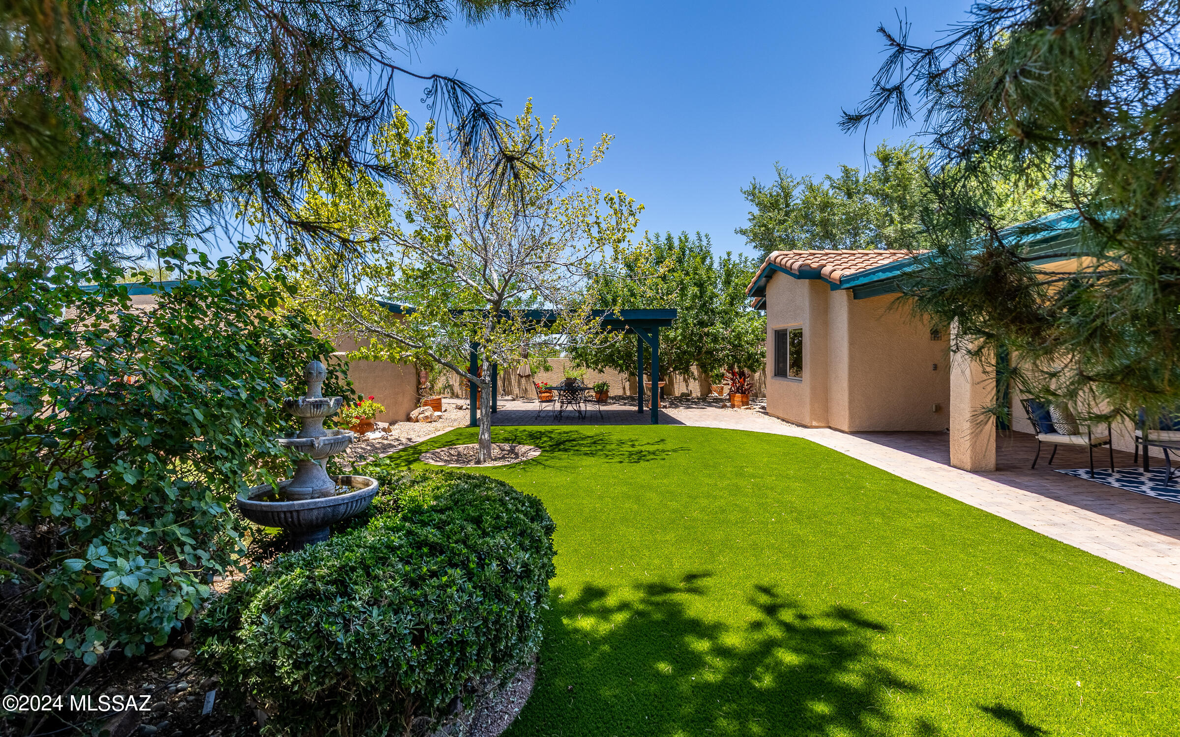 341 Sharon Road Vail, AZ 85641 - Photo 40 of 50 a view of a garden with a fountain