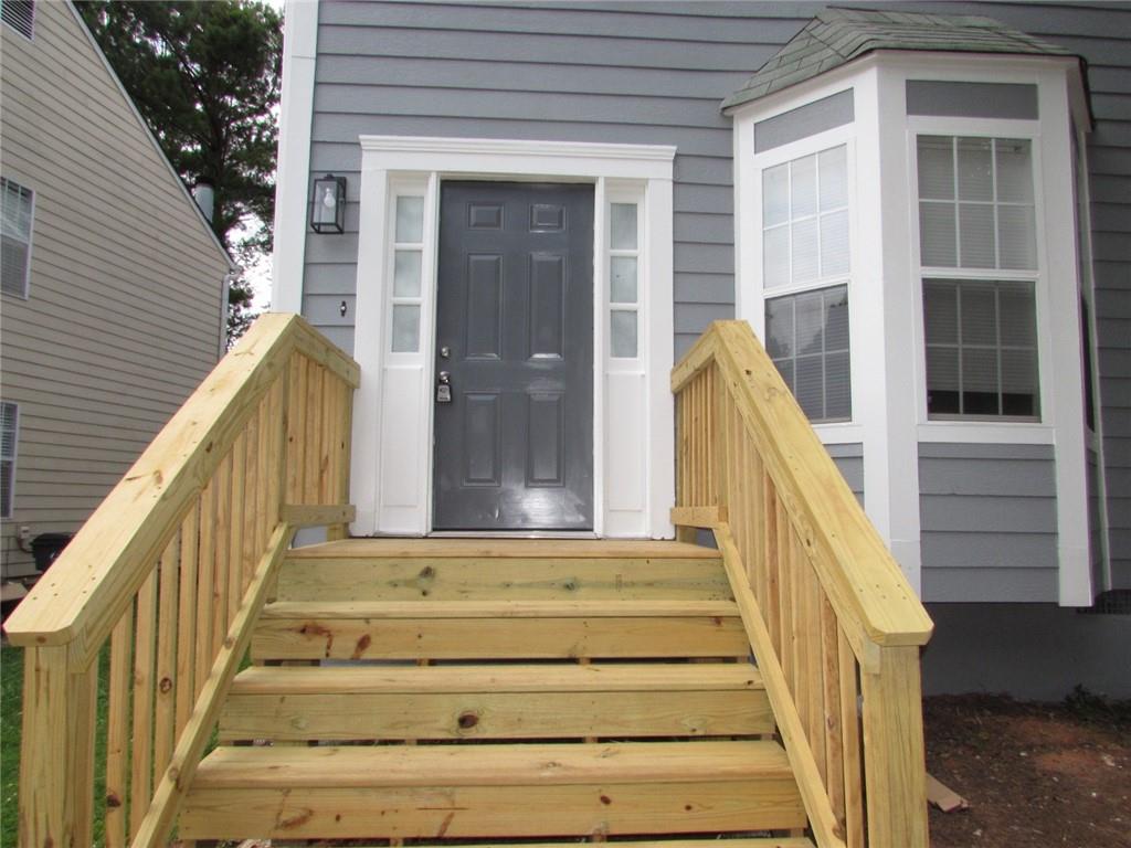 835 Heritage Valley Road Norcross, GA 30093 - Photo 3 of 34 a view of staircase with white walls and windows