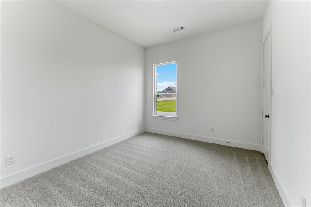 906 Perrin Lane Van Alstyne, TX 75495 - Photo 16 of 30 a view of an empty room with a window