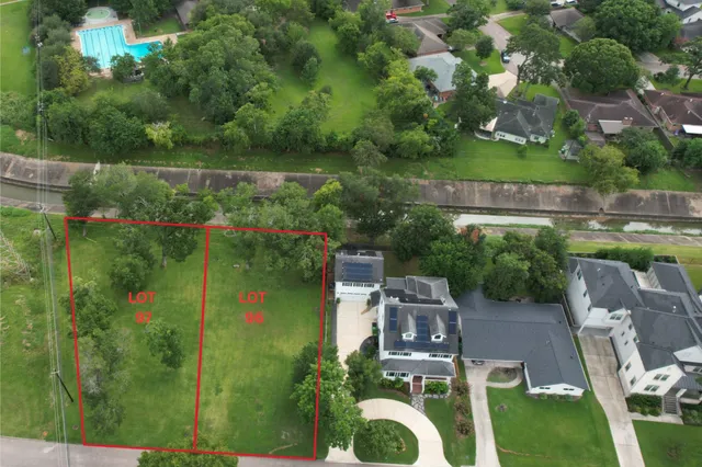 a aerial view of a house with pool outdoor seating and yard