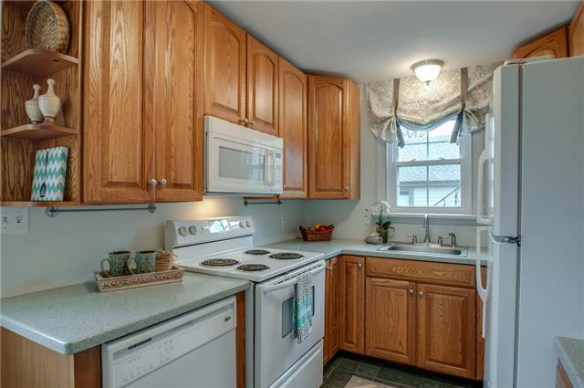 4121 Aberdeen Road Nashville, TN 37205 - Photo 6 of 20 a kitchen with stainless steel appliances granite countertop a sink a stove and a refrigerator