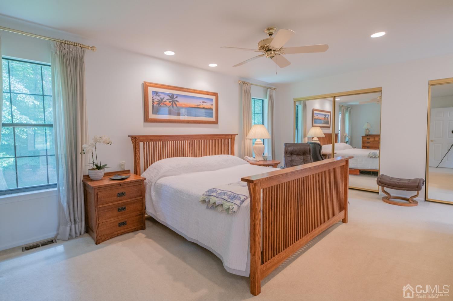 1306 Timber Oaks Road Edison, NJ 08820 - Photo 25 of 47 a bed room with a bed and a chandelier