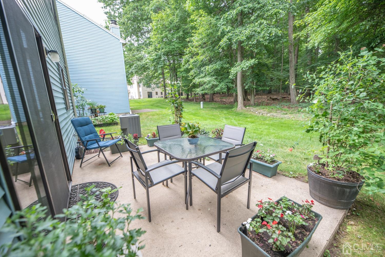 1306 Timber Oaks Road Edison, NJ 08820 - Photo 39 of 47 a view of a backyard with sitting area and garden