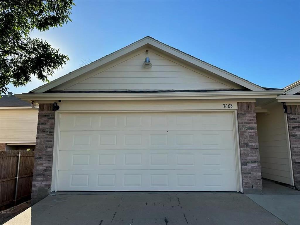 a front view of a house with garage
