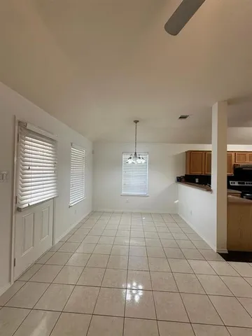 a view of a kitchen with a sink and a stove top oven
