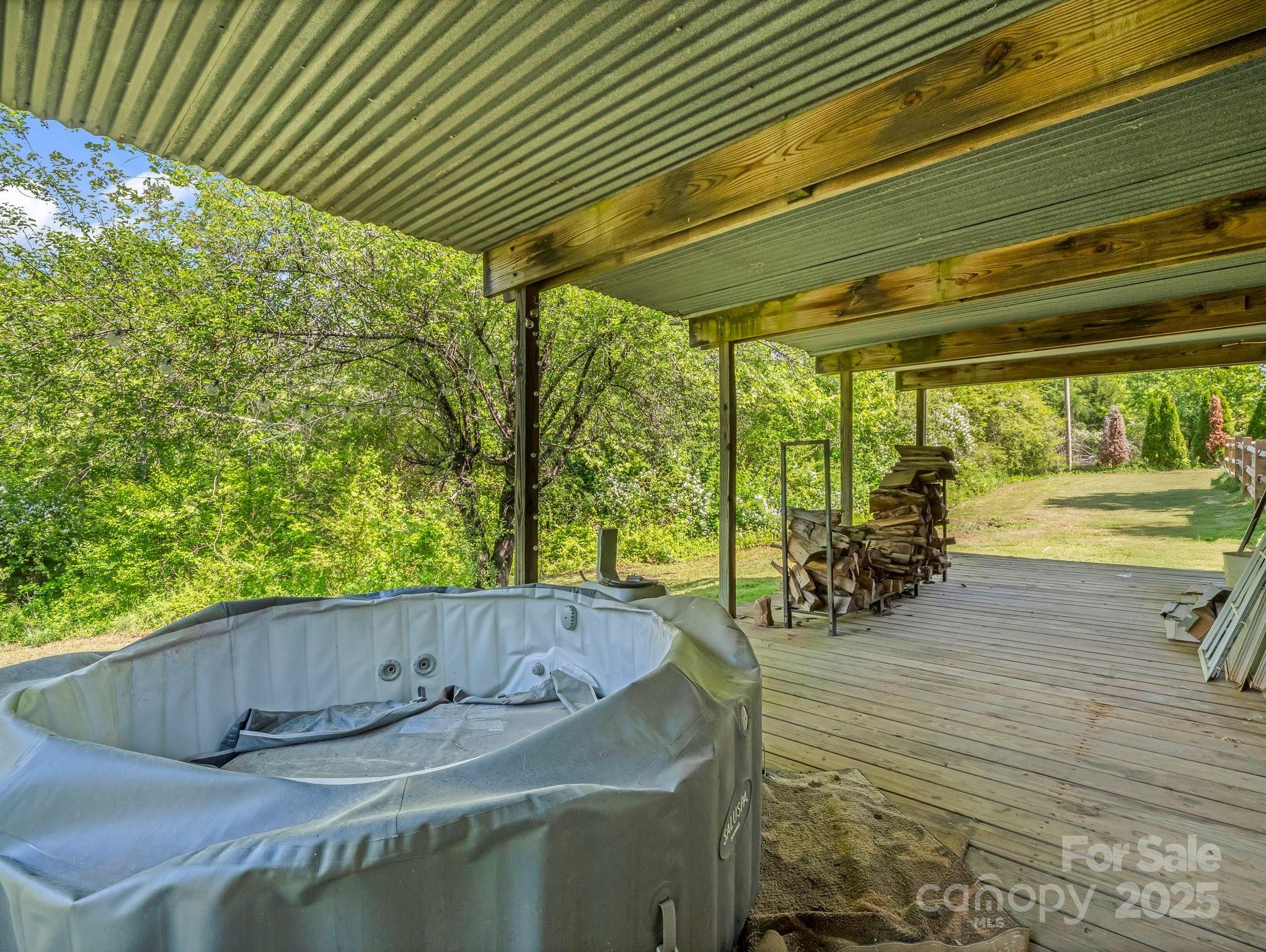 1586 Union Road Rutherfordton, NC 28139 - Photo 8 of 43 a backyard of a house with table and chairs and wooden floor