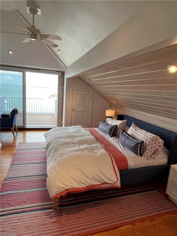 105 Useppa Bokeelia, FL 33922 - Photo 11 of 39 a bedroom with a bed and wooden floor