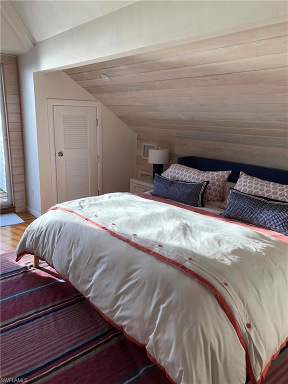 105 Useppa Bokeelia, FL 33922 - Photo 12 of 39 a bedroom with a bed and wooden floor