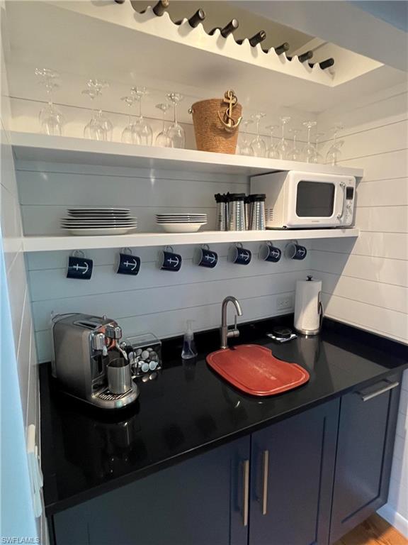 105 Useppa Bokeelia, FL 33922 - Photo 18 of 39 a kitchen with a sink a stove and cabinets