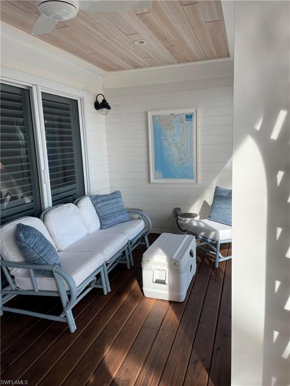 105 Useppa Bokeelia, FL 33922 - Photo 26 of 39 a living room with couches chairs and couches with wooden floor