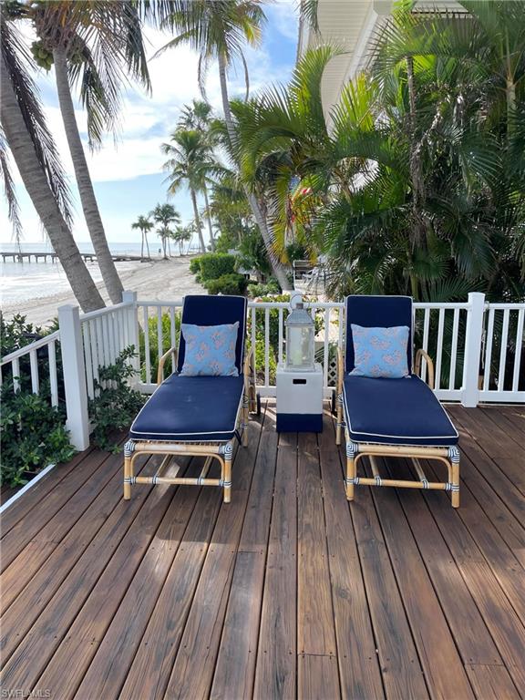 105 Useppa Bokeelia, FL 33922 - Photo 30 of 39 a view of a chairs on deck of a house