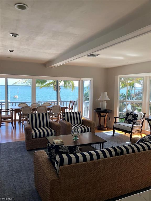 105 Useppa Bokeelia, FL 33922 - Photo 3 of 39 a living room with furniture and a large window