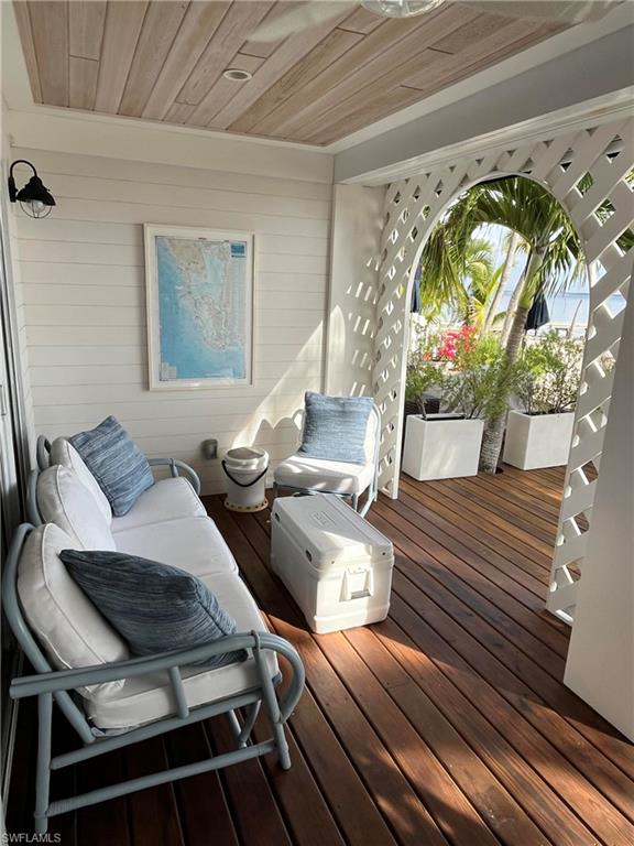 105 Useppa Bokeelia, FL 33922 - Photo 37 of 39 a living room with furniture and a wooden floor