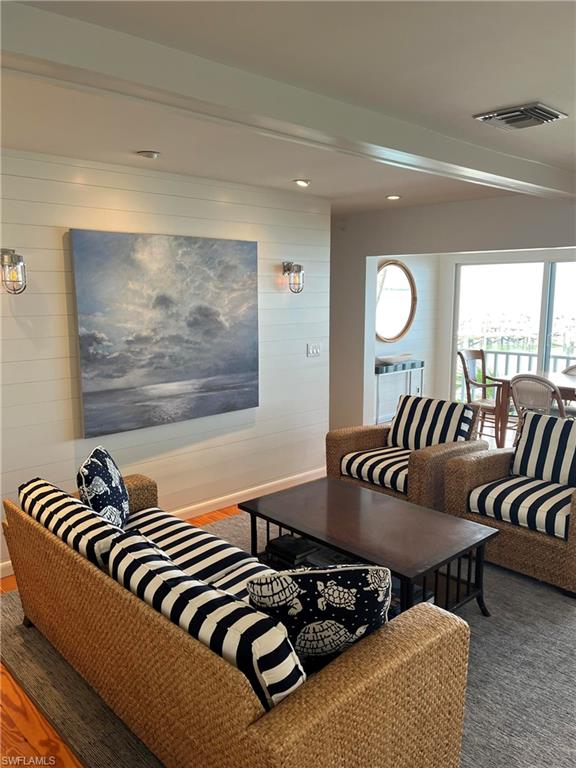 105 Useppa Bokeelia, FL 33922 - Photo 4 of 39 a bedroom with furniture and wooden floor