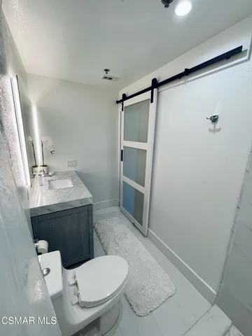 a bathroom with a toilet and a sink