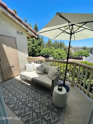 a view of a terrace with couches and potted plants