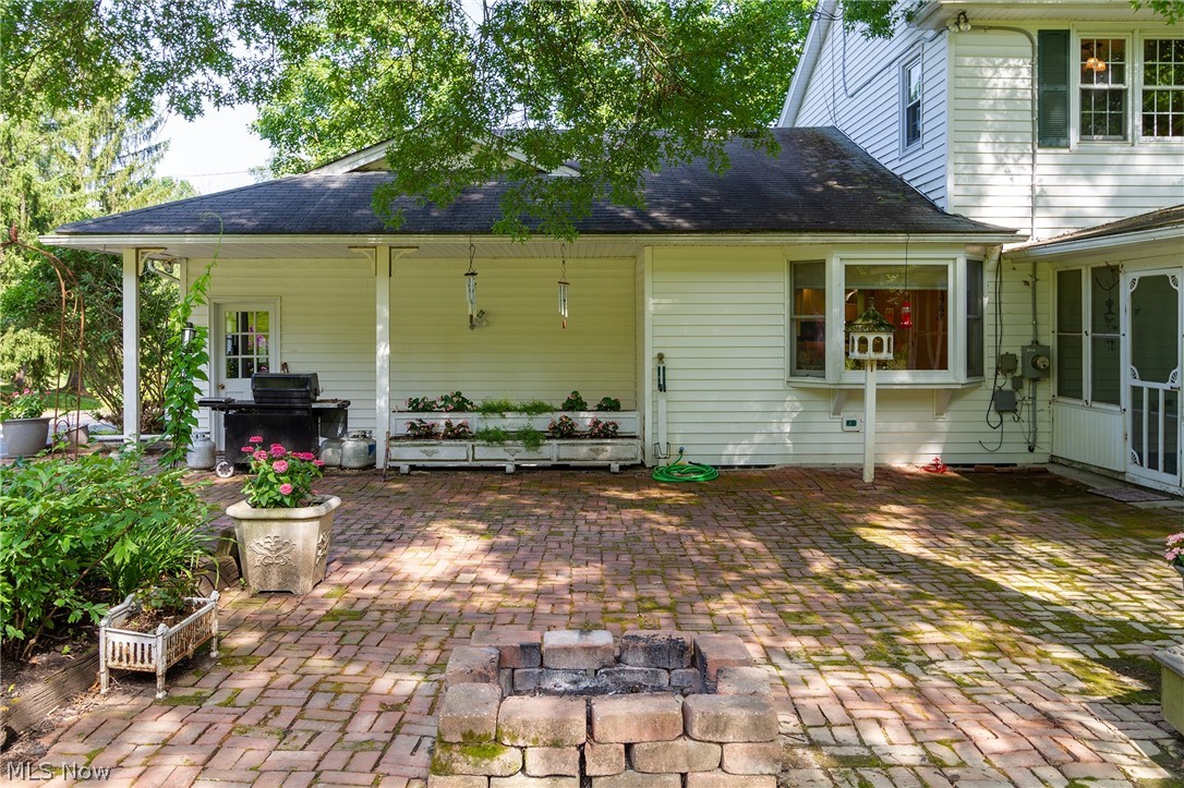 968 Rolling Meadows Road Akron, OH 44333 - Photo 24 of 35 Fire Pit and Perennial gardens will surround you on your very large brick patio - Great for outdoor entertaining