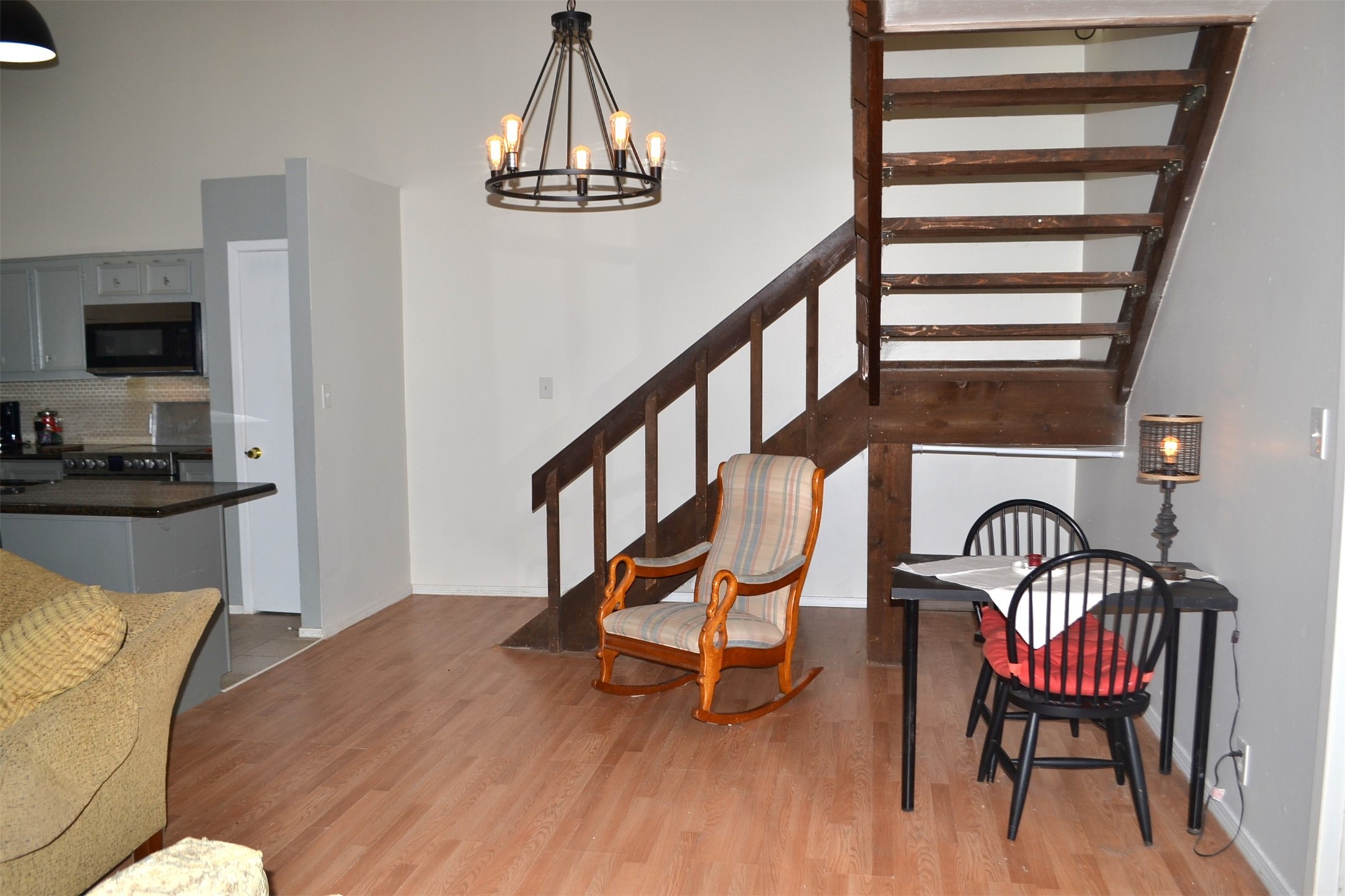 2931 Whitman Drive Montgomery, TX 77356 - Photo 11 of 49 a view of a dining room with furniture a chandelier and wooden floor