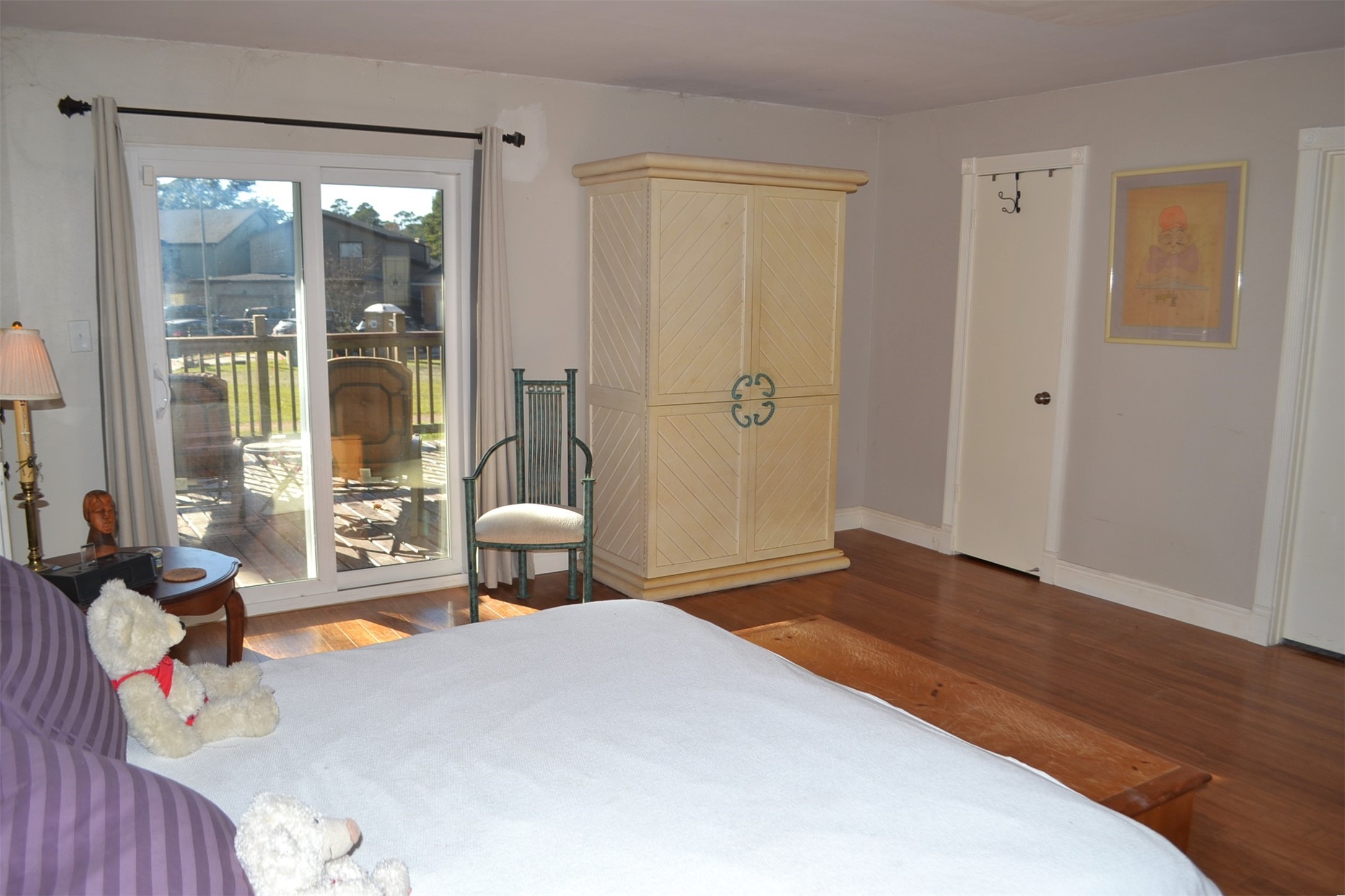 2931 Whitman Drive Montgomery, TX 77356 - Photo 20 of 49 a bedroom with a bed and a large window with balcony view