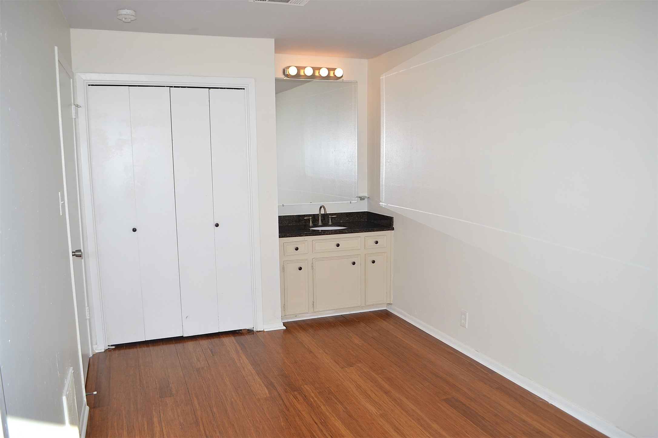 2931 Whitman Drive Montgomery, TX 77356 - Photo 36 of 49 a view of an empty room with wooden floor