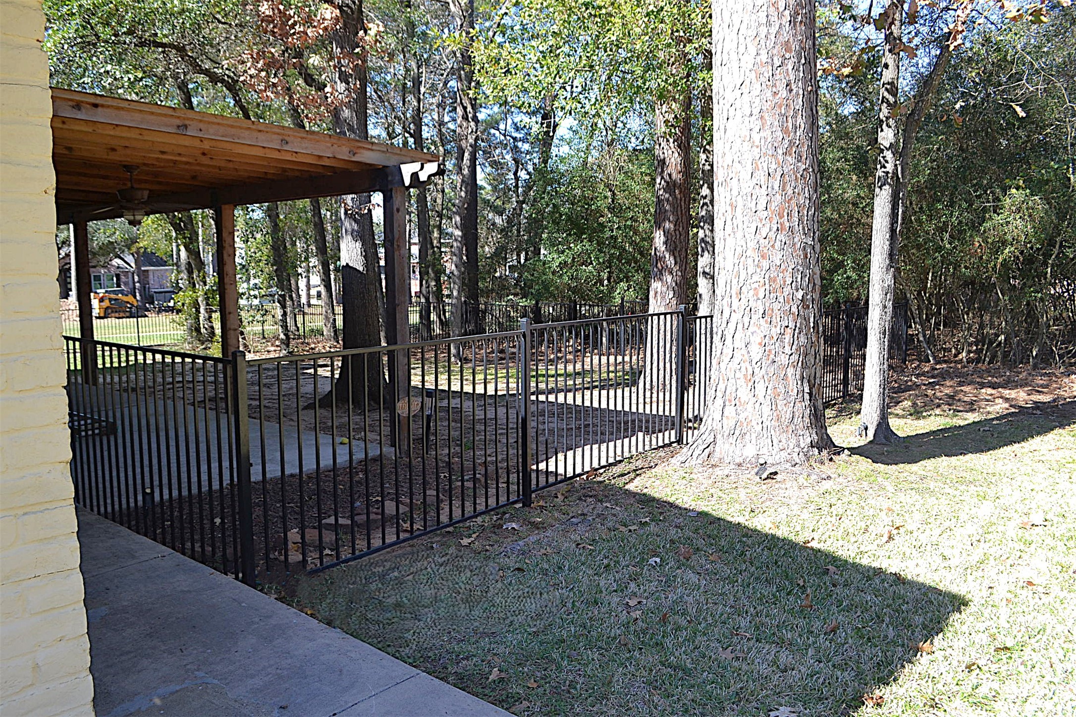 2931 Whitman Drive Montgomery, TX 77356 - Photo 6 of 49 a view of a backyard with a large tree
