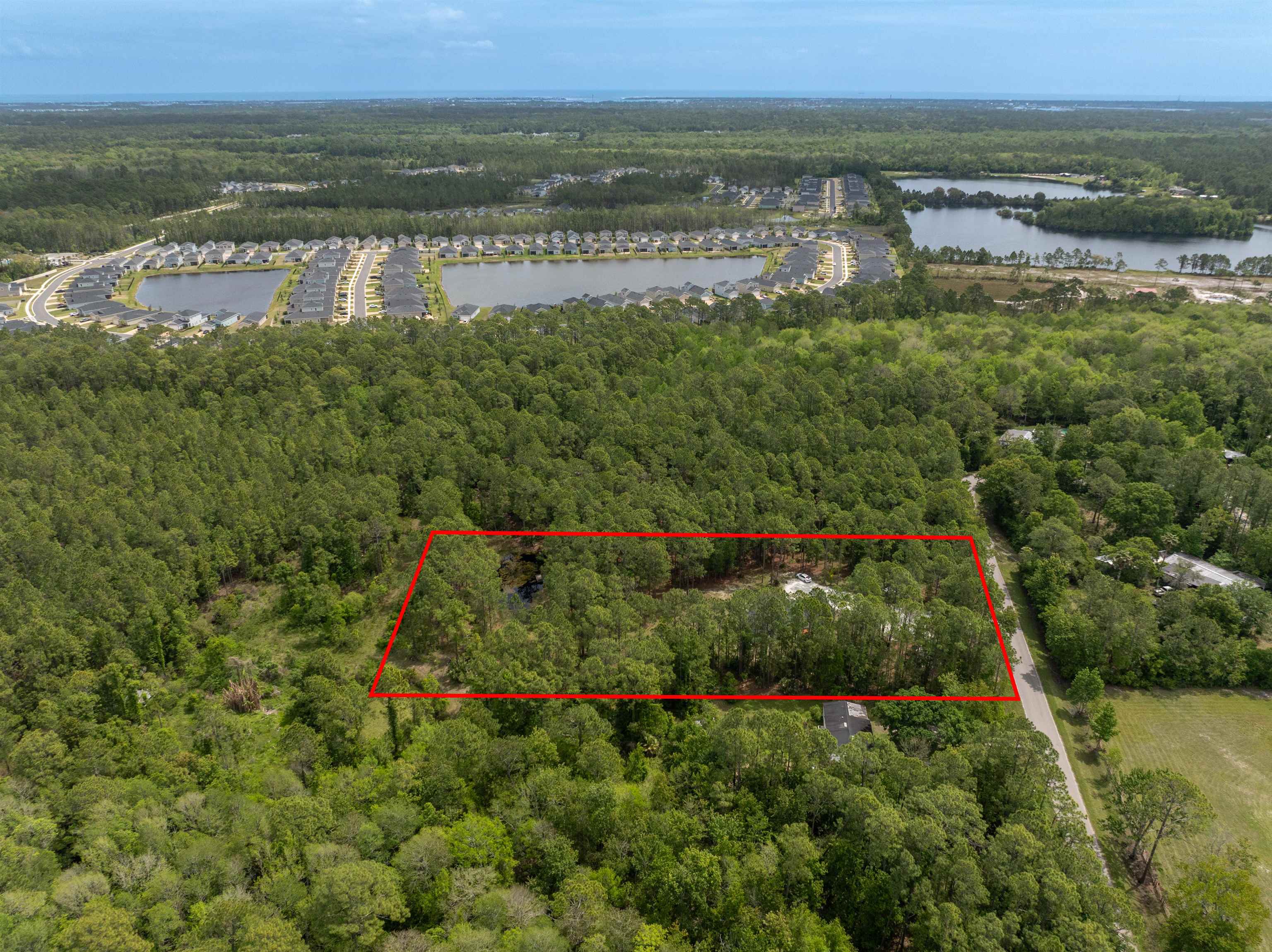 2130 Carter Road St. Augustine, FL 32084 - Photo 57 of 67 Aerial view of property's location with property parcel outlined and a large body of water