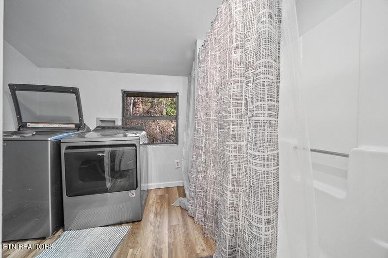 4204 Dellinger Hollow Road, Unit 2 Sevierville, TN 37863 - Photo 11 of 13 a kitchen with a stove and a shower