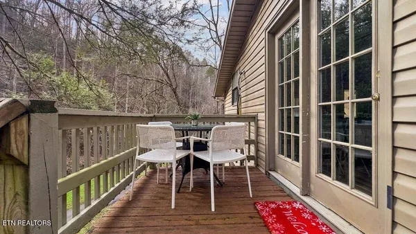 a view of a chairs and table on the deck