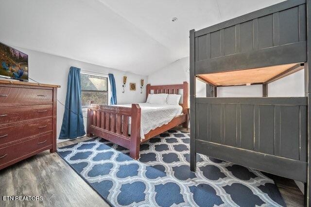 4204 Dellinger Hollow Road, Unit 2 Sevierville, TN 37863 - Photo 9 of 13 a bedroom with a bed and wooden floor