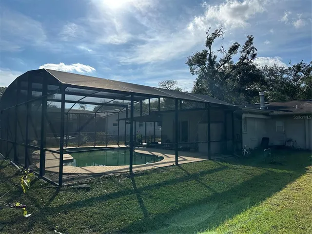 a backyard of a house with lots of green space
